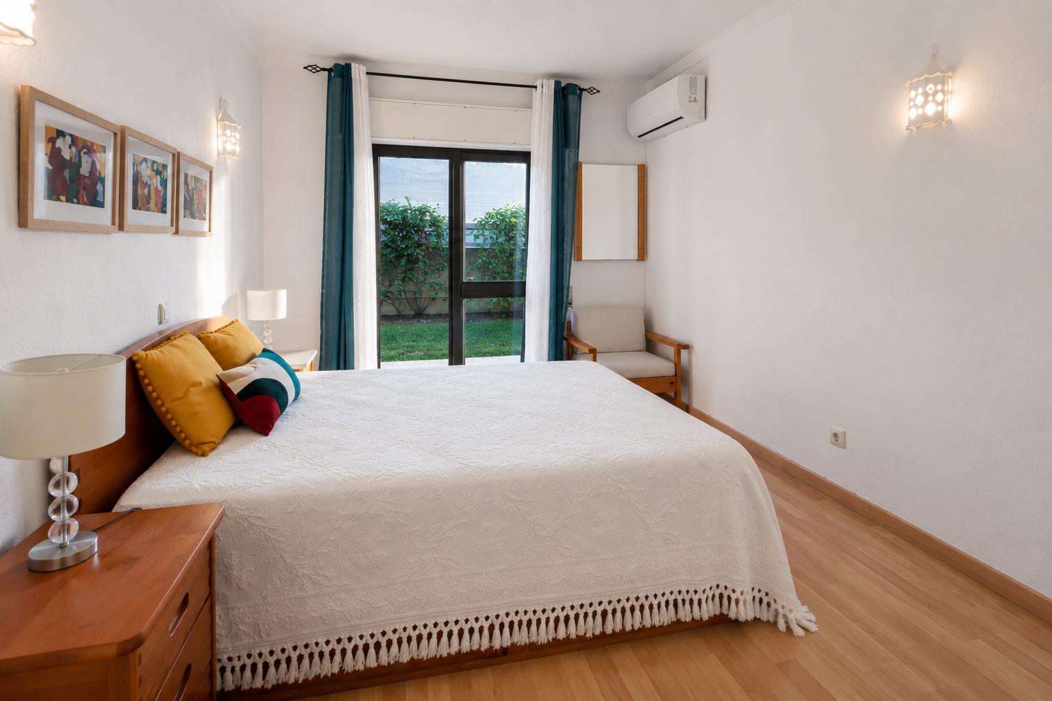 Main bedroom — second view showing wardrobe and natural light